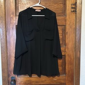 Black blouse size 2X, long over the hip, v-neck pocket front with a cute cuff